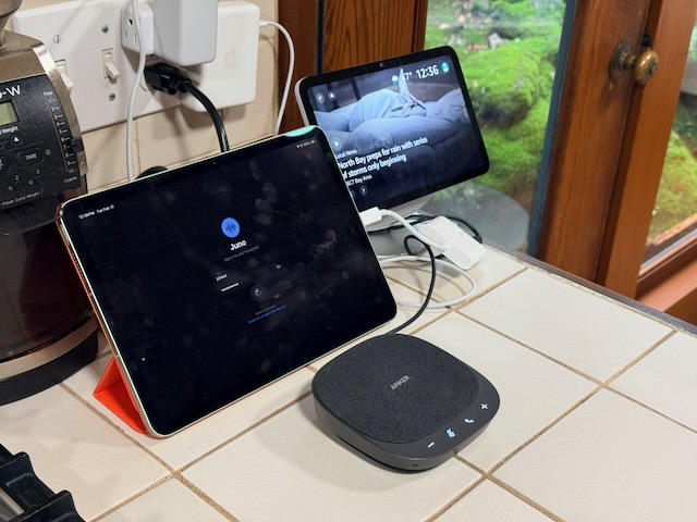 The Juno prototype iPad kit sitting on a kitchen counter with the Anker speakerphone